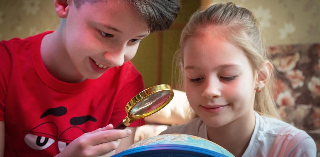 Planning Your Next Family Trip 4 Planning Your Next Family Trip - Kids Looking at a Globe