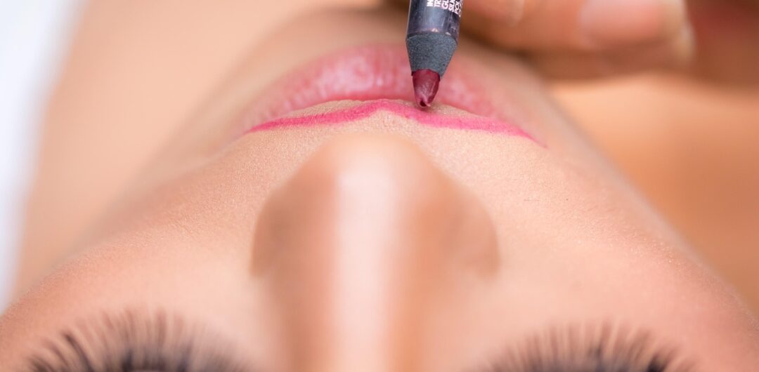 14 Ways to Enhance Your Beauty - Woman Lining Her Lips