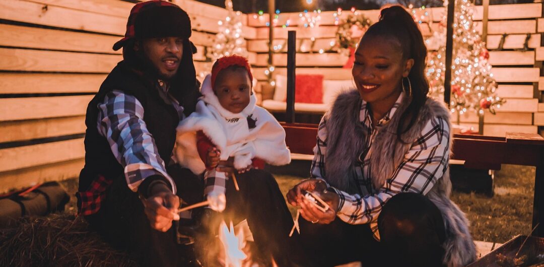 Why Less Stuff and More Time Together Matters This Christmas - Family by a Fire Pit