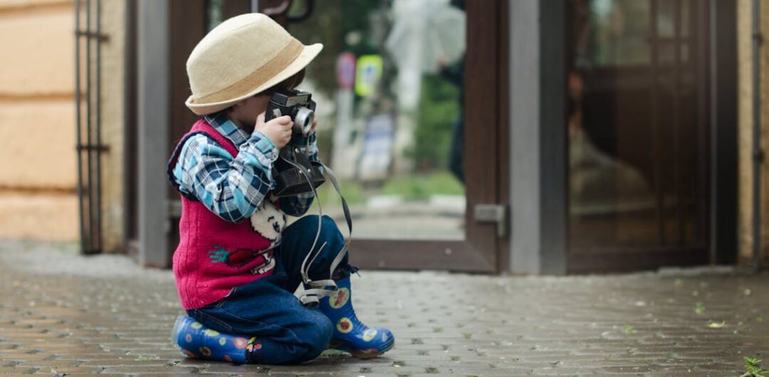 How to Convince Your Kids Traveling is a Good Idea! 1 How to Convince Your Kids Traveling is a Good Idea! - Child with Camera