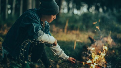3 Ways to Stay Warm When Camping - Man By a Bonfire