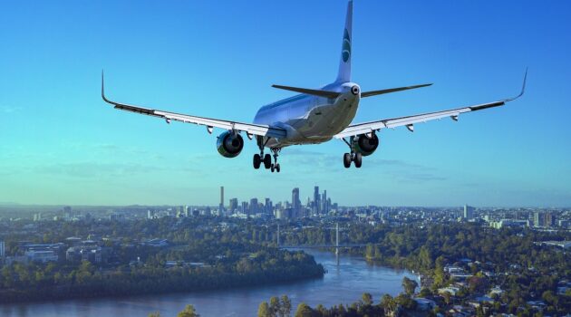 6 Best Companies for Airport Transfers - Airplane Flying Over City