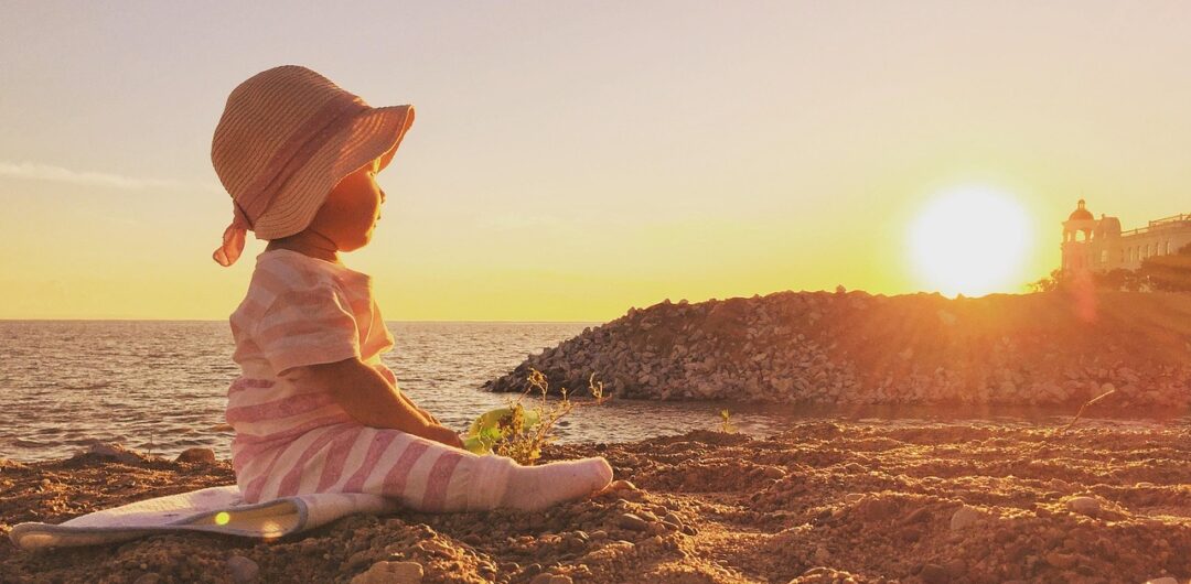 How You Can Travel Comfortably Without Giving Up the Outdoor Experience 2 How You Can Travel Comfortably Without Giving Up the Outdoor Experience - Baby Sitting on the Beach