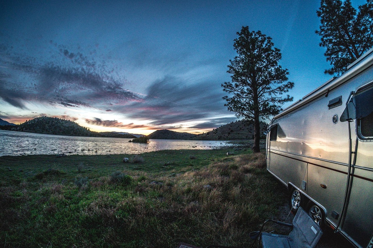 3 Tips to Make Your Next RV Adventure Better Than Ever 2 Love Adventure Here’s Why You Should Buy an RV - RV at Sunset by a Lakes