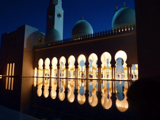 Why Abu Dhabi Should Be Your Next Big Adventure - Mosque at Night Reflected in Water