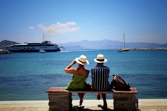 Why You Sometimes Need to Take a Break on Holiday - People Siting on a Bench by Water