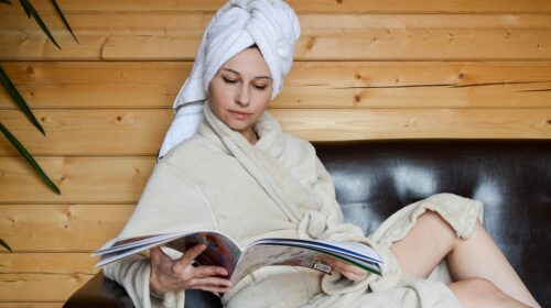Why You Sometimes Need to Take a Break on Holiday - Woman Reading in a Robe Here’s How to Stay Clean on a Road Trip without Feeling Gross