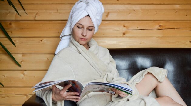 Why You Sometimes Need to Take a Break on Holiday - Woman Reading in a Robe Here’s How to Stay Clean on a Road Trip without Feeling Gross