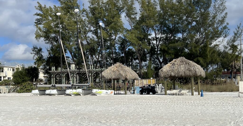 Silver Surf Gulf Beach Resort: A Coastal Gem for Couples on Anna Maria Island, FL 4 Silver Surf Gulf Beach Resort - covered beach chairs on private beach