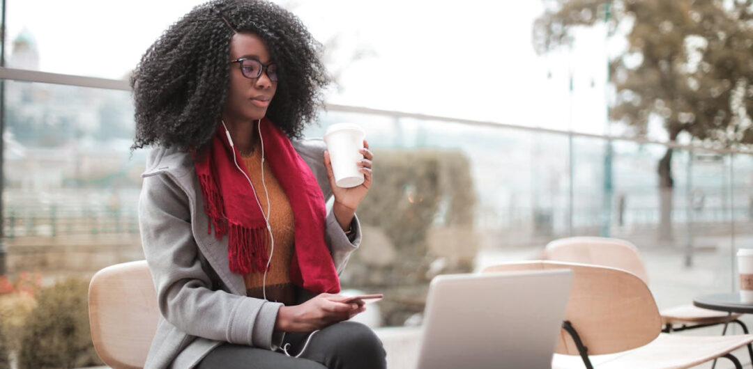 Digital Nomads: Read This for Tips on How to Work While Adventuring 1 Digital Nomads: Read This for Tips on How to Work While Adventuring - Woman Holding Phone and Coffee