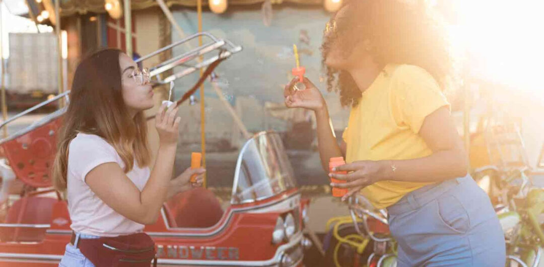 Fun Activities for Theme Park Downtime and Waiting in Lines - Girls Playing with Bubbles