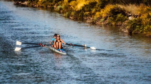 Dive Into These 3 US Cities If You Love Water Sports - Women in a Row Boat