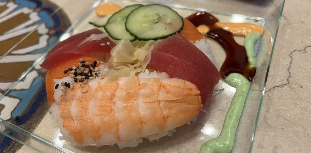 Must-Do Experiences at EPCOT International Festivals - Japan kiosk festival of the arts giant sushi donut