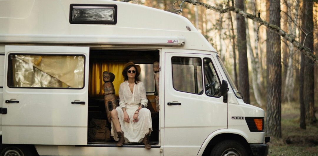 Planning Your First RV Road Trip in 2026: Three Important Elements to Consider - Woman Sitting in a Van