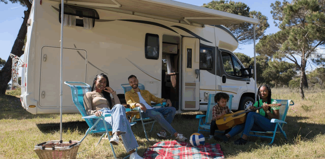 How to Relax When You Are Traveling in an RV 1 How to Relax When You Are Traveling in an RV - Family Relaxing In Front of a RV