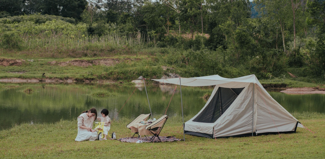 The 3 of The Best Types Of Vacations For Kids 2 The 3 of The Best Types Of Vacations For Kids - Mother and Child Camping by a Lake