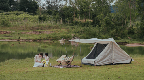 The 3 of The Best Types Of Vacations For Kids - Mother and Child Camping by a Lake 6 Different Ways of Camping for Every Kind of Camper