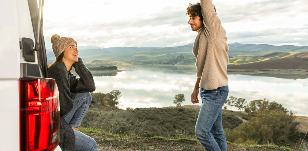 Road Trip Planning: 5 Aspects To Not Overlook - Couple Hanging Out in the Back of Van