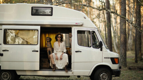 Planning Your First RV Road Trip in 2026: Three Important Elements to Consider - Woman Sitting in a Van