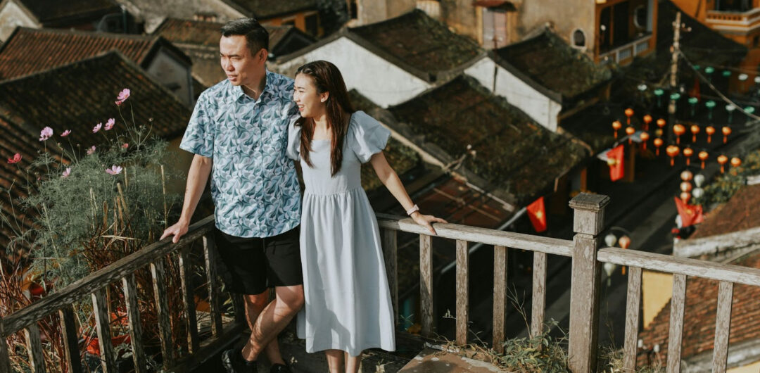 4 Reasons Why the Best Trips Leave You Feeling Different 1 4 Reasons Why the Best Trips Leave You Feeling Different - Couple Looking Around at the Top of a Building