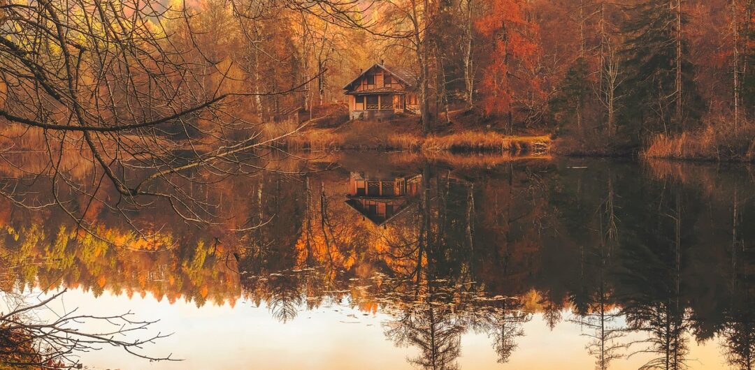 5 North American Destinations that Let You Truly Unplug from Life - Autumn Cabin on a Lake
