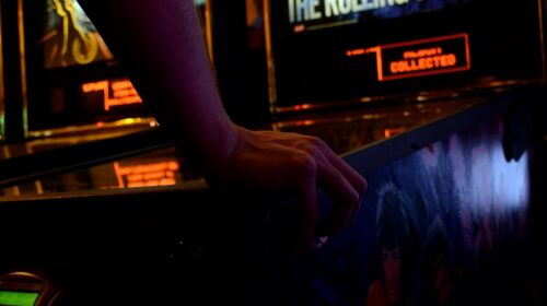 Why Arcades Make Every Trip More Fun and Memorable - Close Up on a Pinball Machine