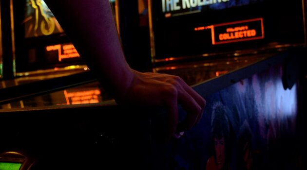 Why Arcades Make Every Trip More Fun and Memorable - Close Up on a Pinball Machine
