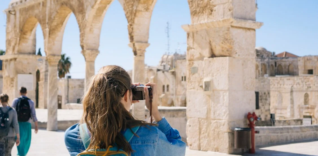 How Can You Plan Travel without Falling for Viral Tourist Traps? 1 How Can You Plan Travel without Falling for Viral Tourist Traps? - Woman Taking Photos