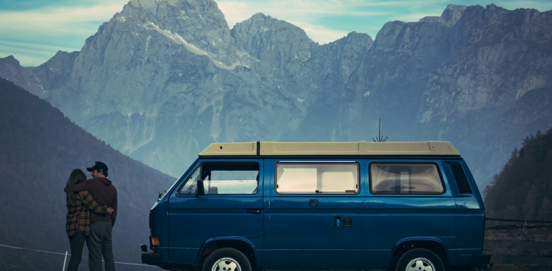 Why Road Trips Make Amazing Weekend Resets - Couple looking at Mountains